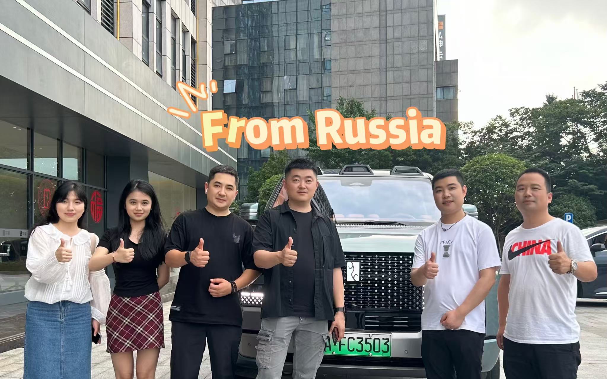 Hejiecheng team with Russian client before vehicle delivery